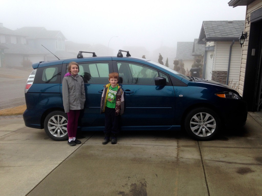 Miranda (11) and Ian (7) and "our car"